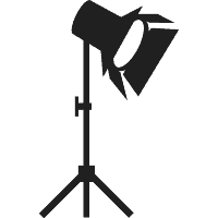 Black studio spotlight on a tripod stand.